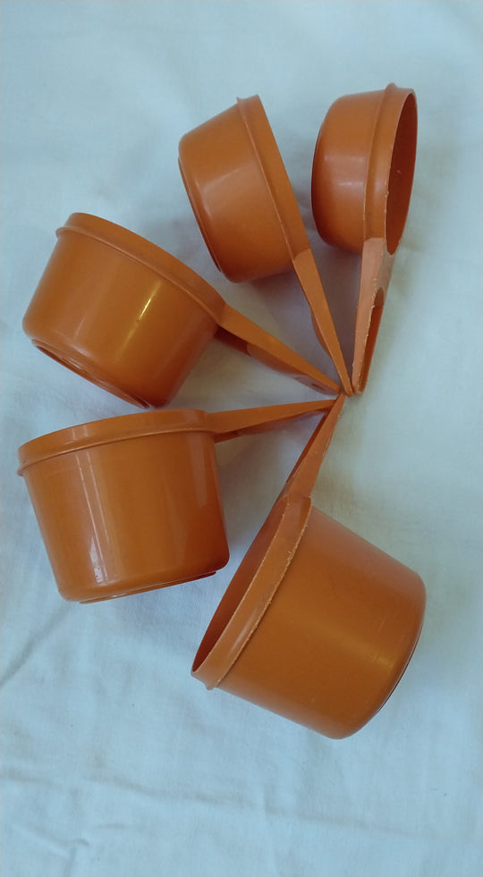 Vintage Tupperware Orange Measuring Cups