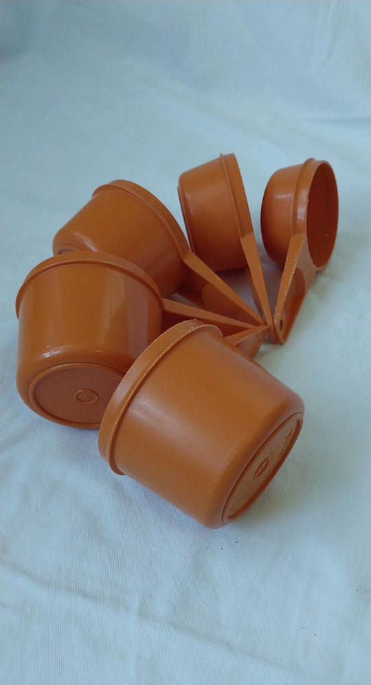 Vintage Tupperware Orange Measuring Cups