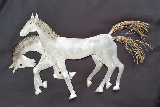 Metal wall art of two Horses