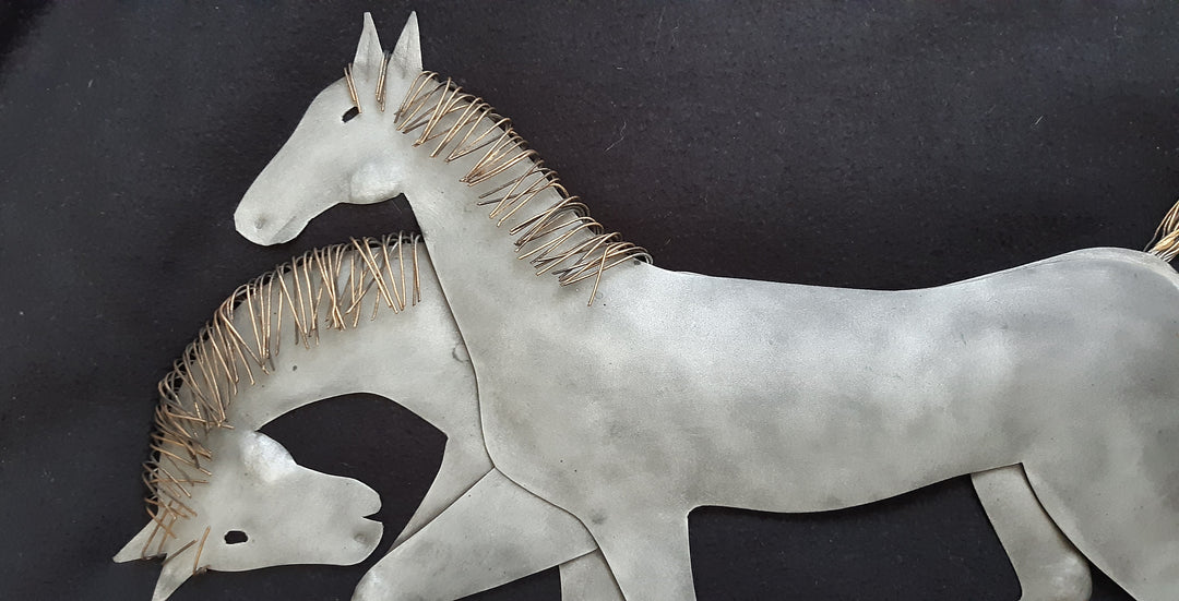 Metal wall art of two Horses